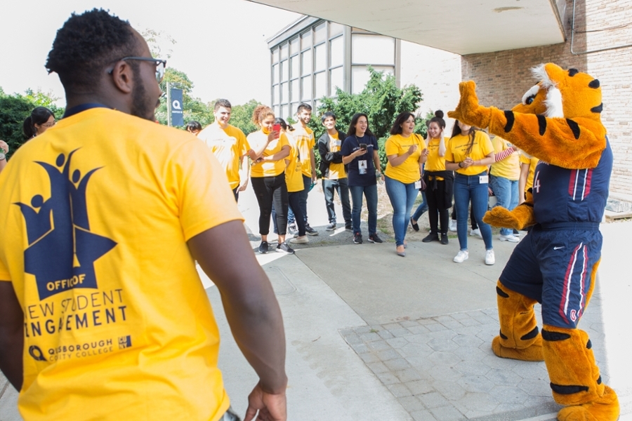 qcc tiger with students wearing yellow tshirts