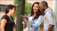 A student on campus welcoming new students