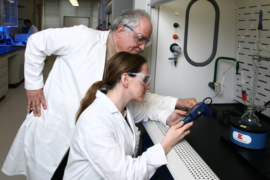 Student in the Chemistry lab with professor