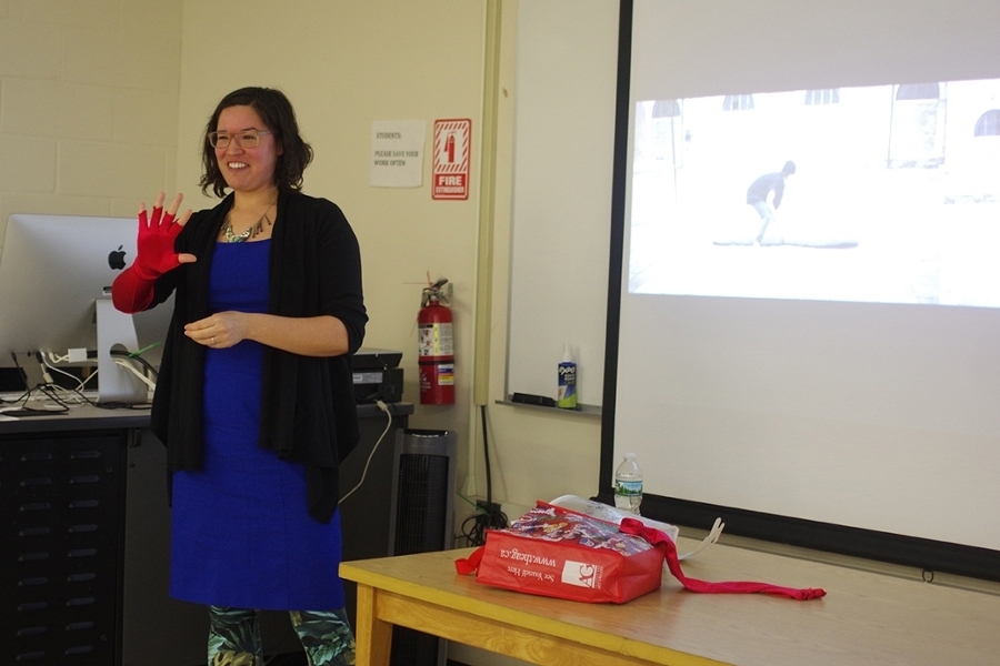 Maria Hupfield, visiting artist, with a red glove she created