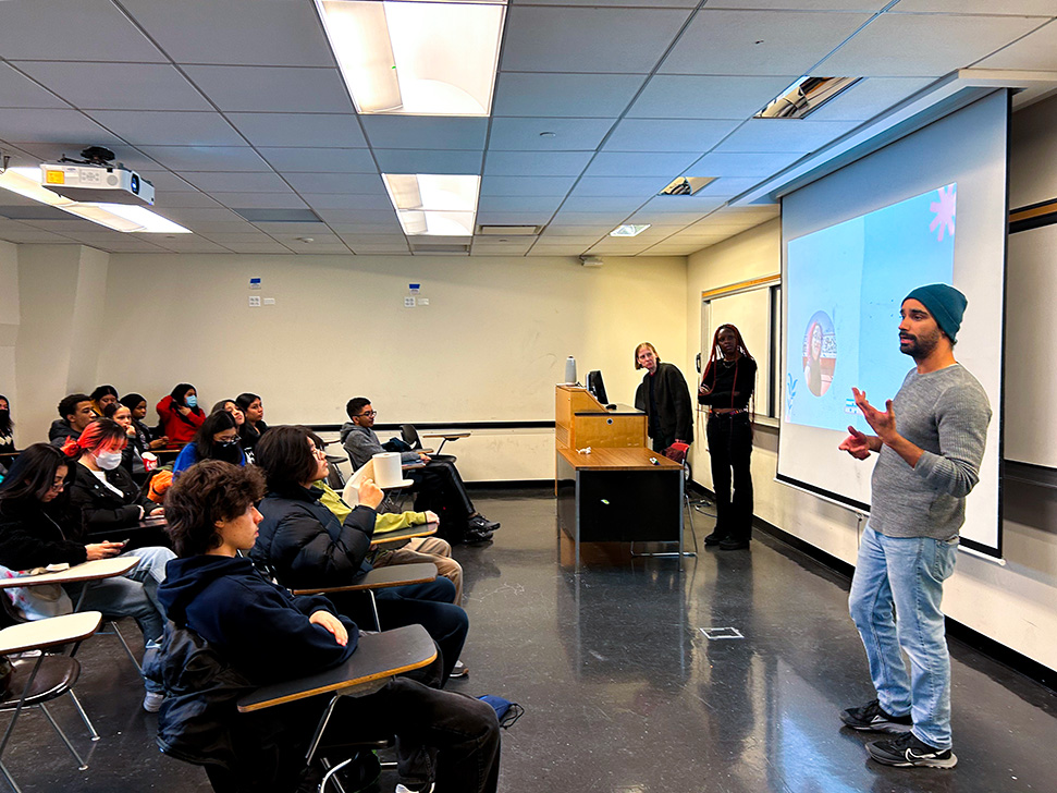 Man addressing students in a classroom