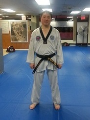 Dr. Shin wearing Taekwondo attire