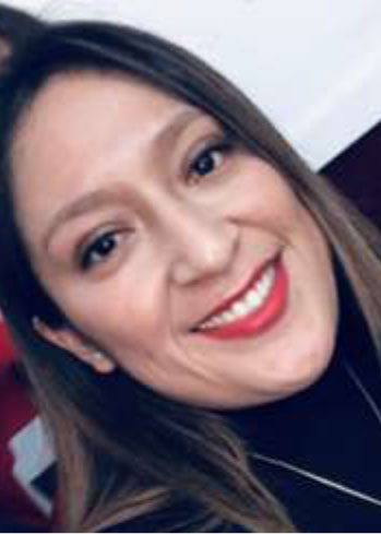 headshot of Tania Montesdeoca, smiling brunette