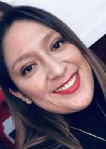 headshot of Tania Montesdeoca, smiling brunette