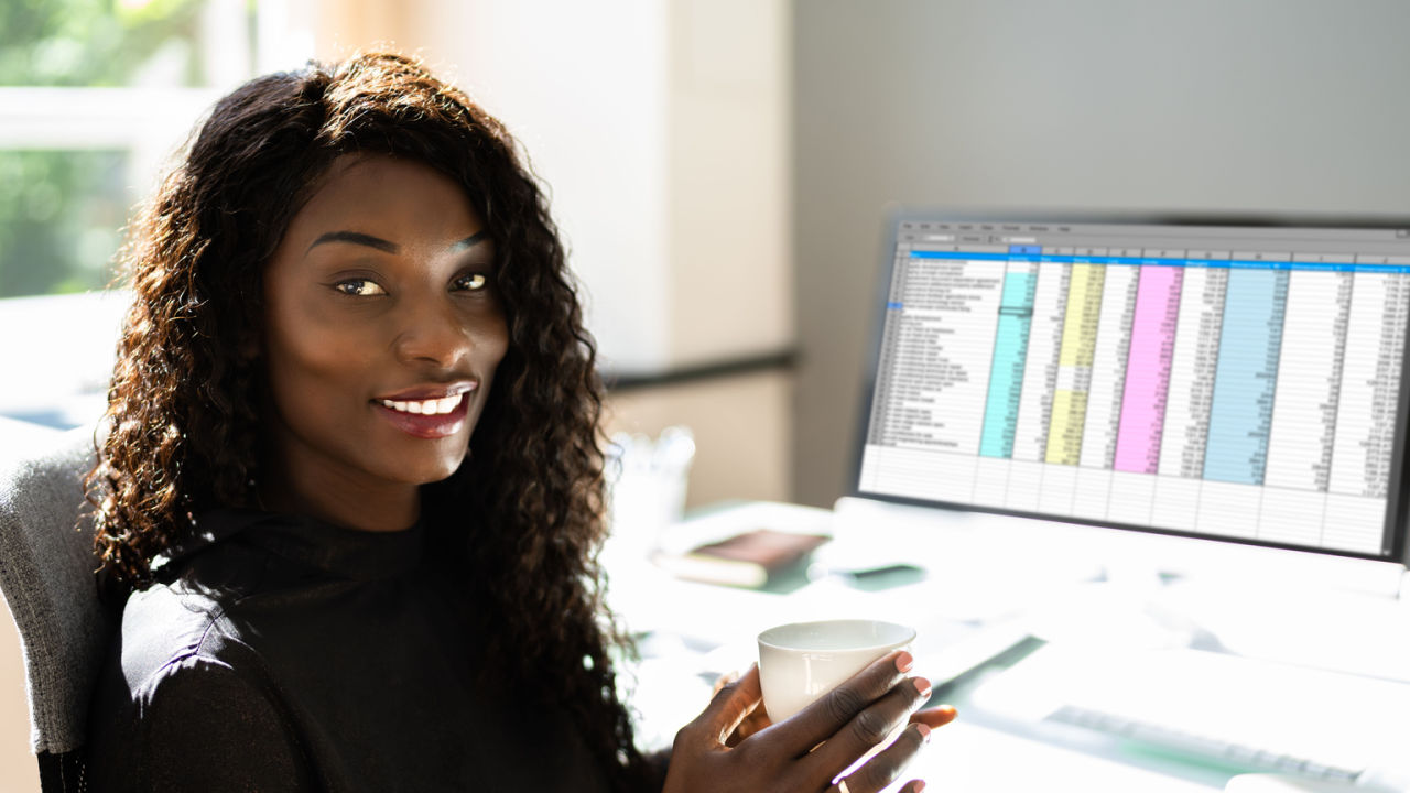 Photo of a certified coding and billing specialist at a computer