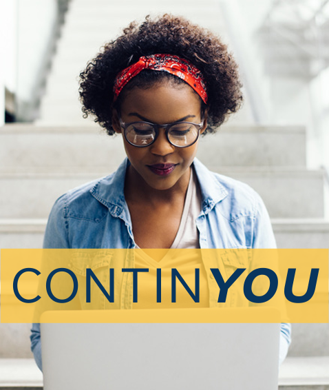 african american female student working on laptop
