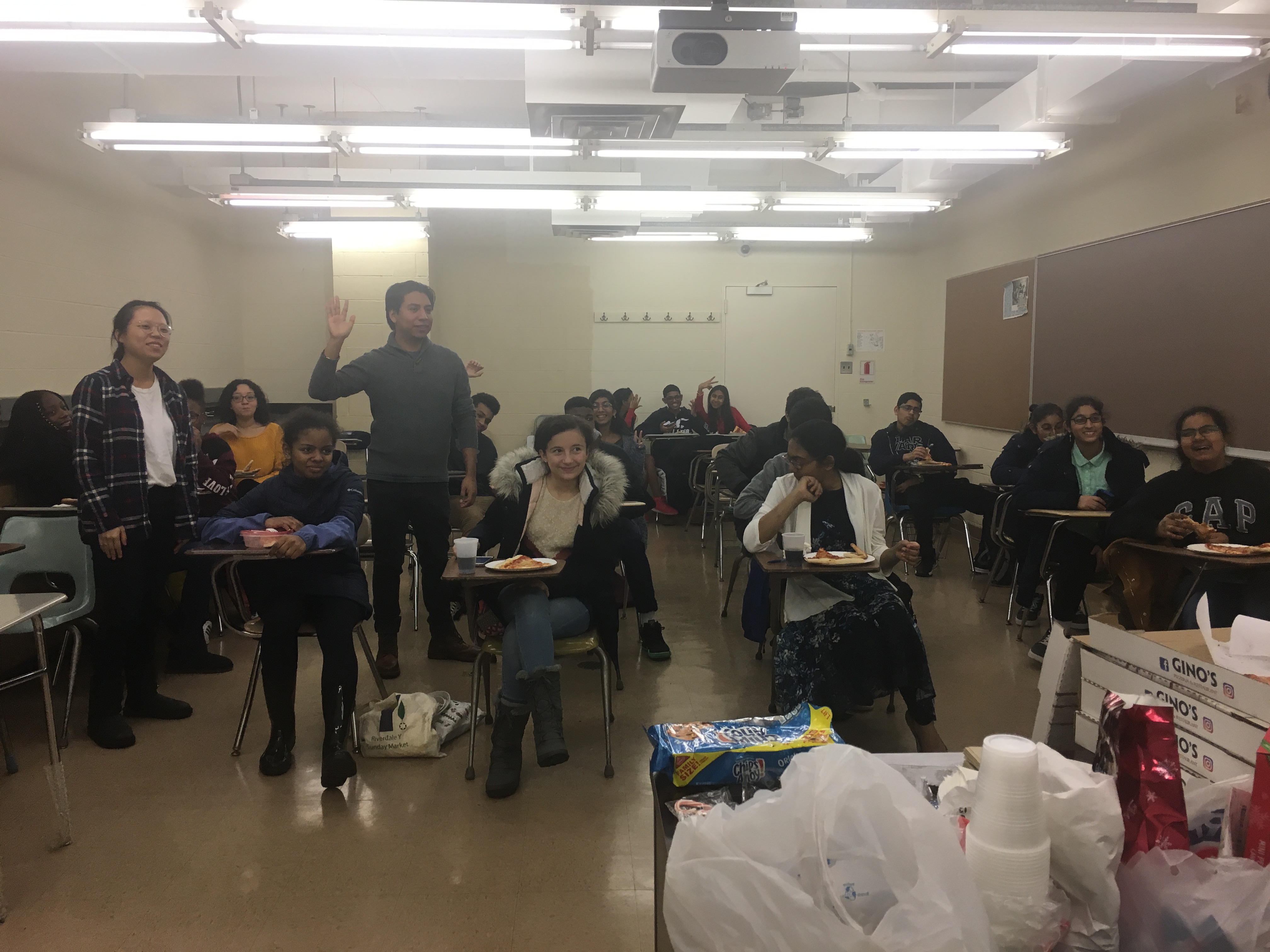 students in classroom during pizza party