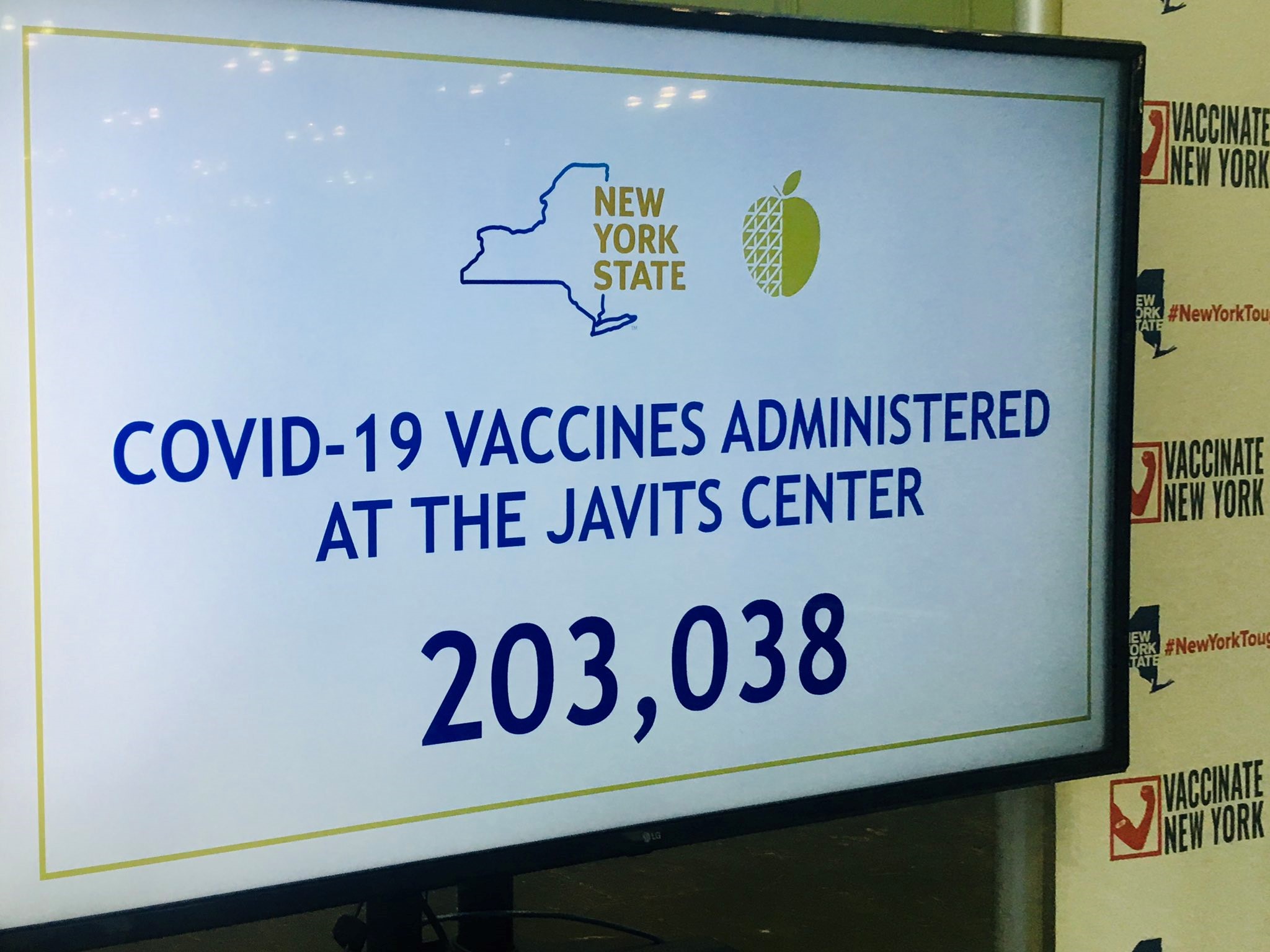 sign at javits center showing number of vaccines administered