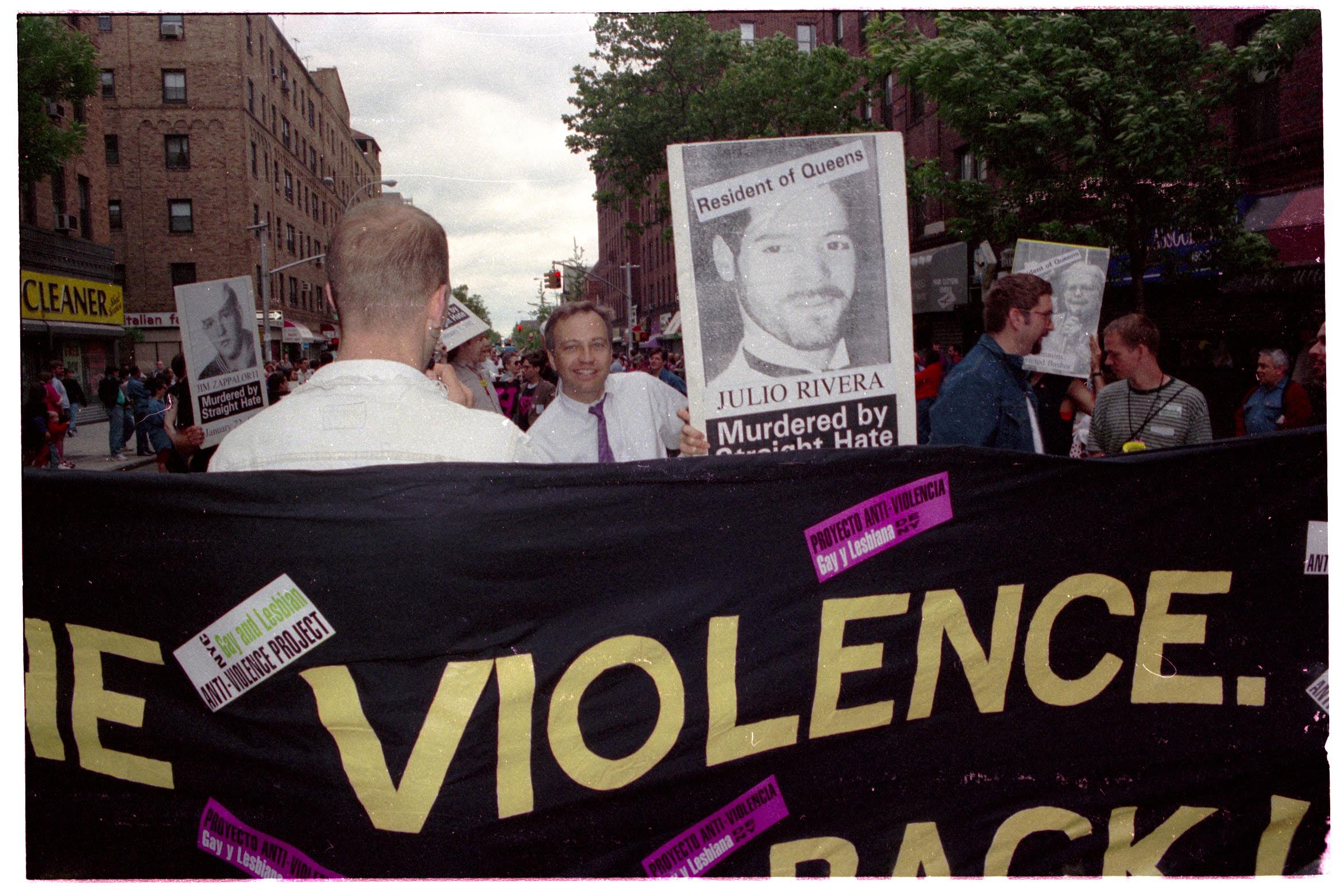 Image of demonstrators marching following the murder of Julio Rivera in 1990