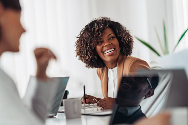 Smiling African American woman sitting at a table