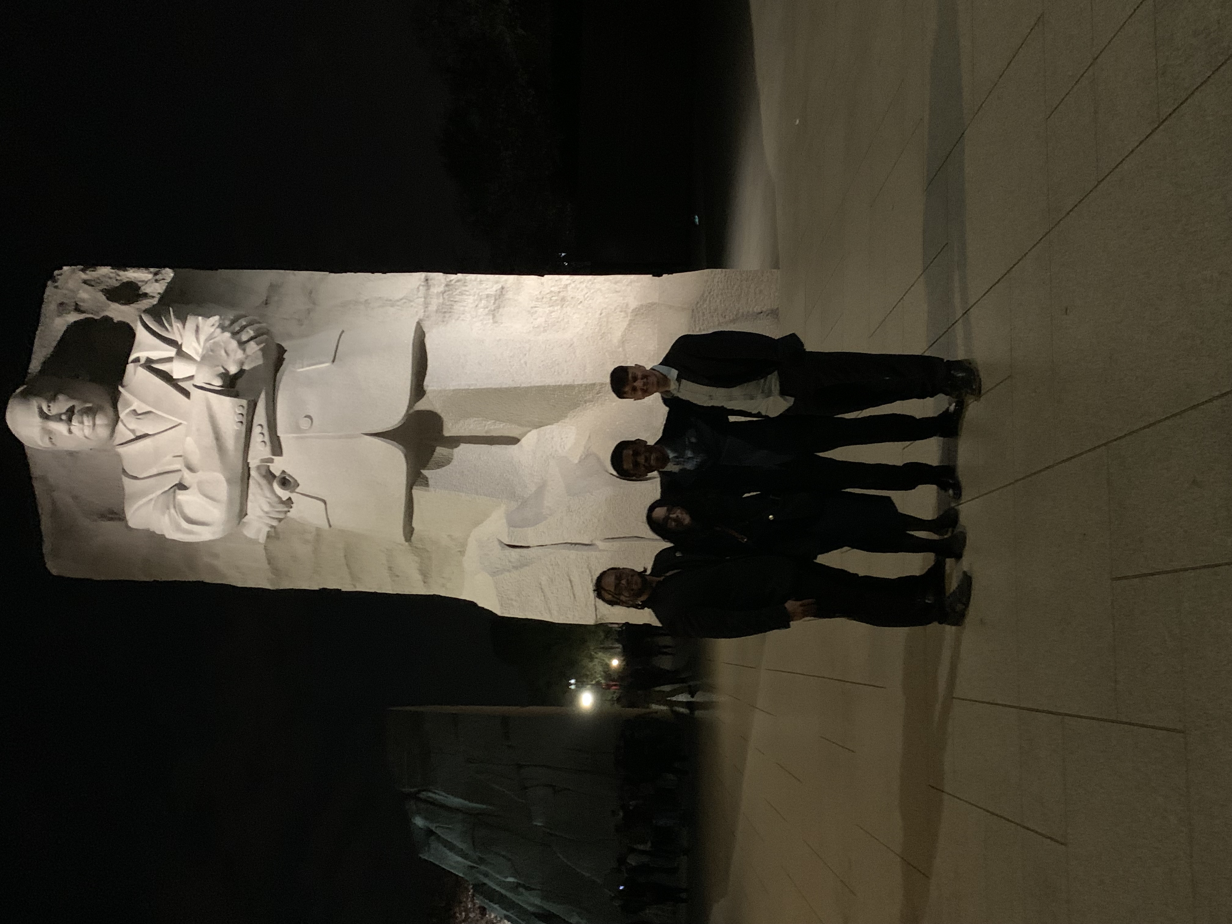 Blackstone Launchpad students standing in front of statue 