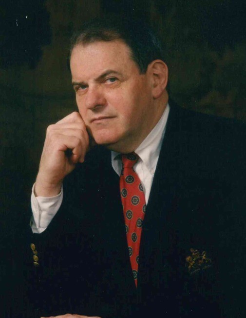 Dr. Emil Polak wearing suit and tie