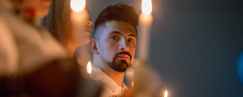 Derek Seo among nursing students during candlelighting ceremony