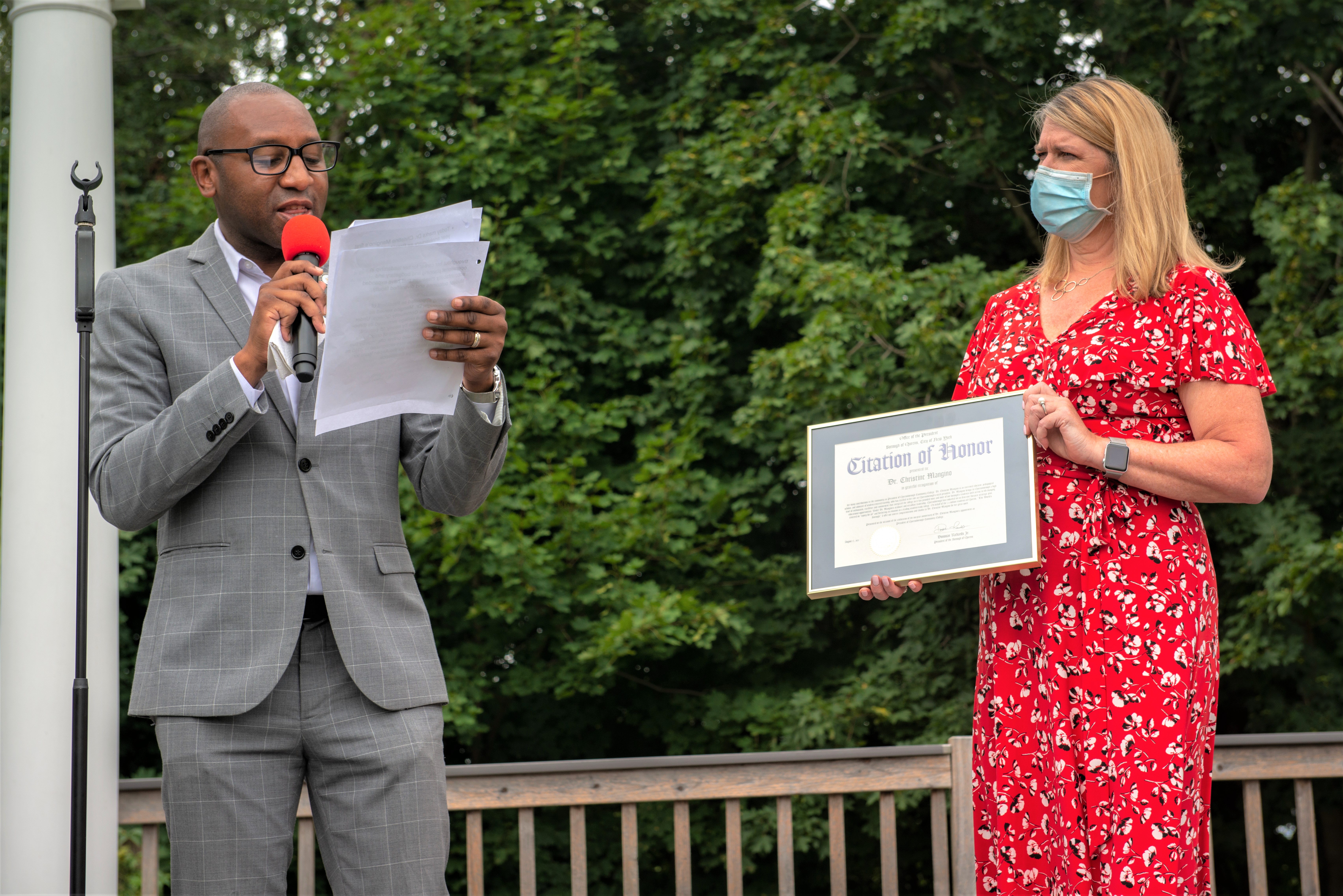 Queens Borough President Donovan Richards presenting award to Queensborough Community College President Dr. Christine Mangino