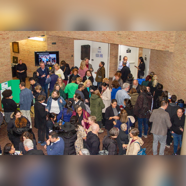 Faculty and staff convening in the Well