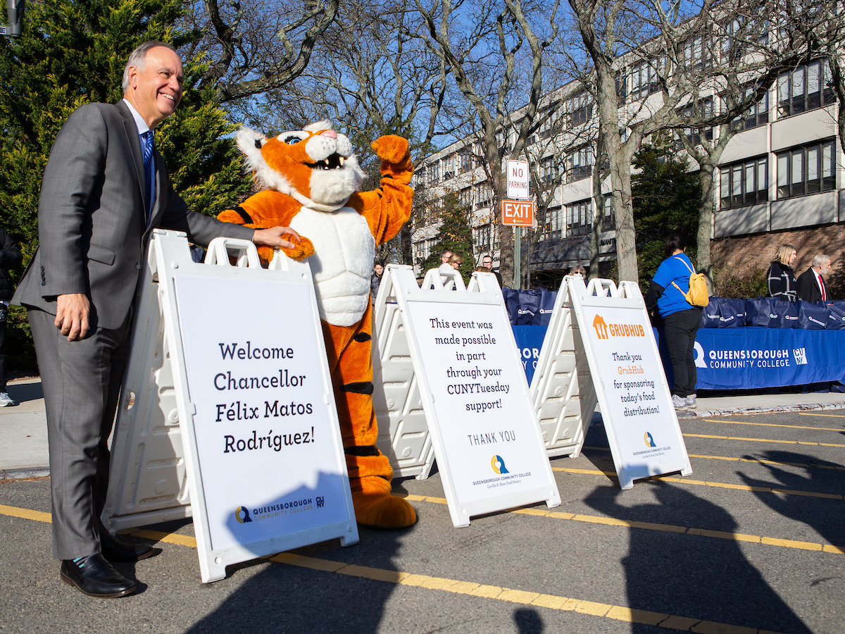 Chencellor Felix at the Food pantry distribution with mascot