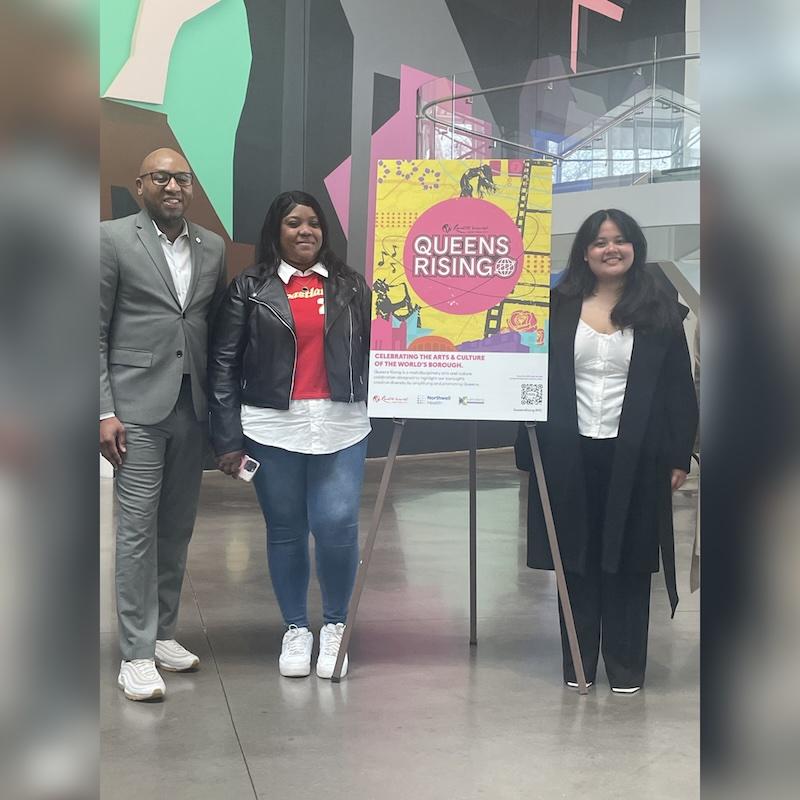 Group shot of Queensborough students Monique Simpson and Angelique York with Queens borough president Donovan Richards Jr.