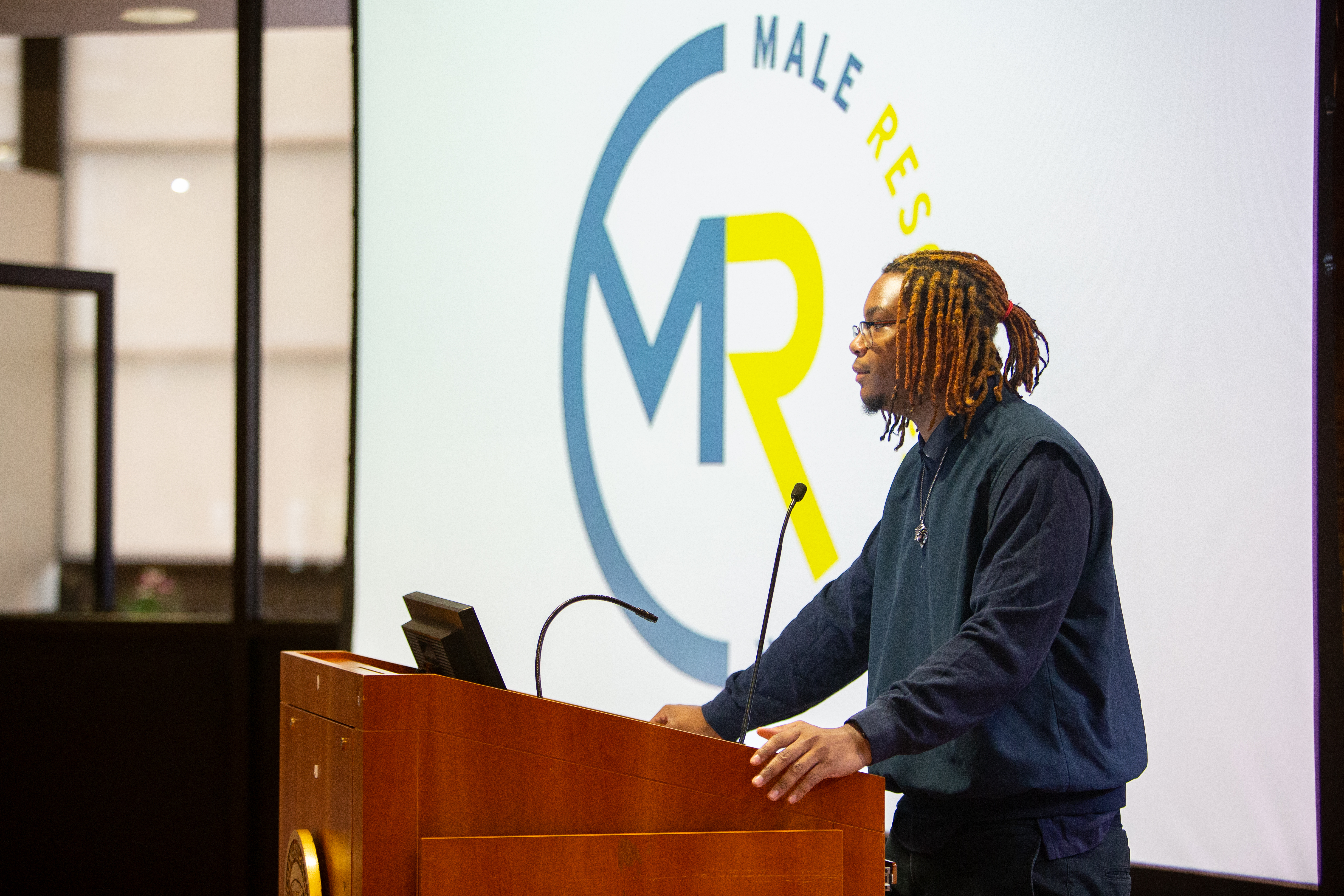 podium at the Male Resource Center