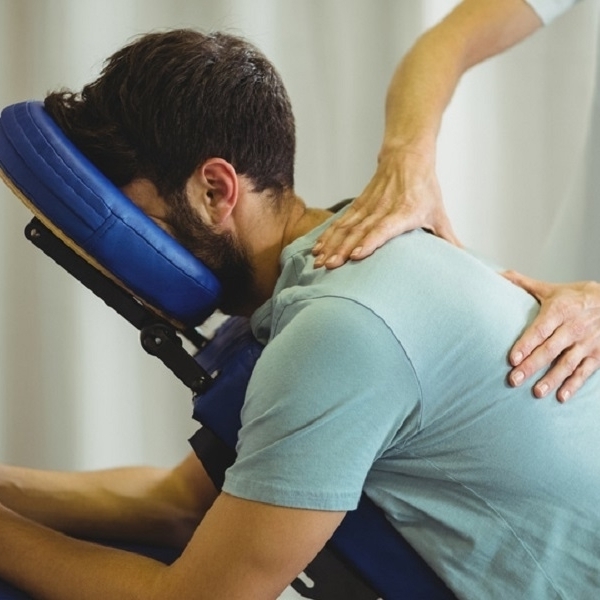 male laying on a massage chair