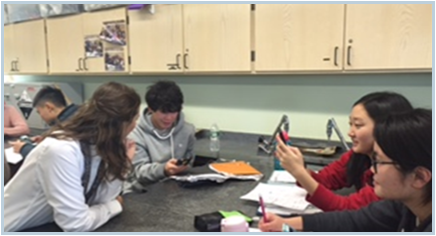 Jessica Joyner (AREM) goes over the high school students' sequencing results with them